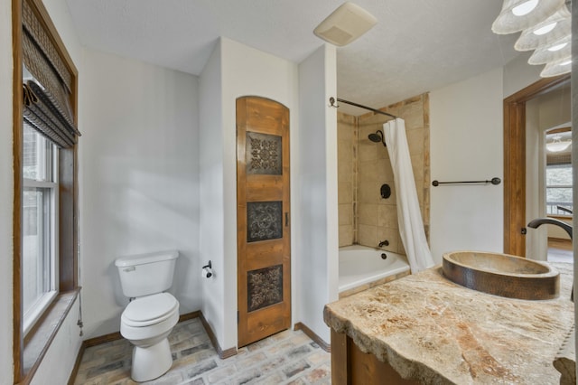 224 Loveland Dr, Rogersville, MO 65742 - full bath with toilet, vanity, shower / bath combo with shower curtain, and baseboards