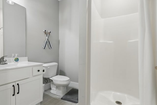 232 Chateau Mountain Hilltop Way, Branson, MO 65616 - bathroom with vanity, a shower stall, toilet, and baseboards