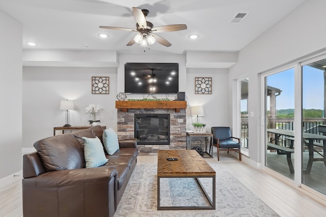 232 Chateau Mountain Hilltop Way, Branson, MO 65616 - living area featuring light wood-type flooring, a ceiling fan, baseboards, a fireplace, and recessed lighting