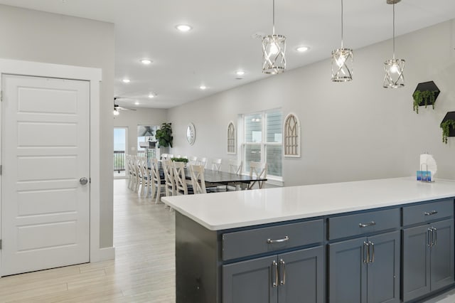 232 Chateau Mountain Hilltop Way, Branson, MO 65616 - kitchen featuring light countertops, ceiling fan, recessed lighting, light wood-style floors, and hanging light fixtures