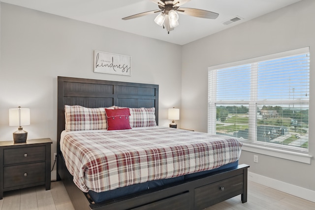 232 Chateau Mountain Hilltop Way, Branson, MO 65616 - bedroom with baseboards, light wood-style flooring, and a ceiling fan