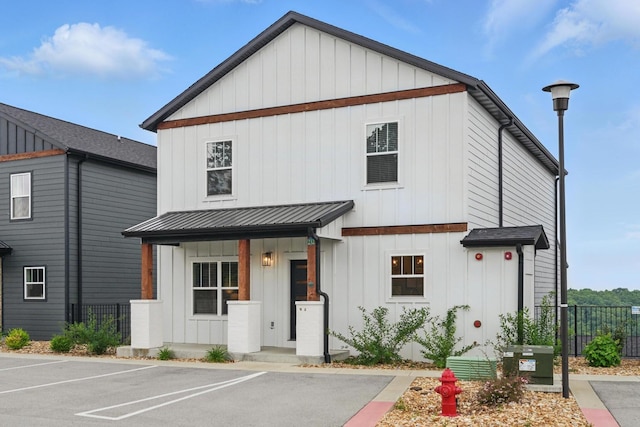 232 Chateau Mountain Hilltop Way, Branson, MO 65616 - modern inspired farmhouse with board and batten siding, uncovered parking, metal roof, and a standing seam roof