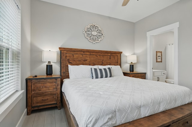 232 Chateau Mountain Hilltop Way, Branson, MO 65616 - bedroom with baseboards, connected bathroom, and ceiling fan