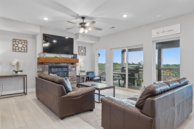 232 Chateau Mountain Hilltop Way, Branson, MO 65616 - living room with plenty of natural light, a stone fireplace, ceiling fan, light wood-style flooring, and recessed lighting