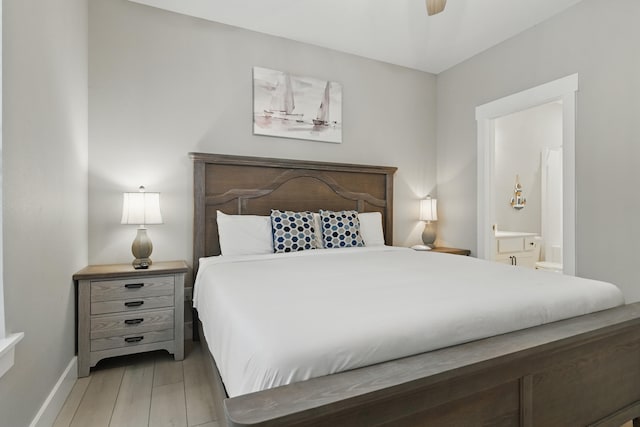 232 Chateau Mountain Hilltop Way, Branson, MO 65616 - bedroom with connected bathroom, baseboards, and a ceiling fan