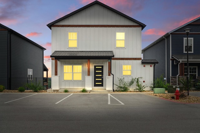 232 Chateau Mountain Hilltop Way, Branson, MO 65616 - view of front facade featuring board and batten siding, uncovered parking, and metal roof