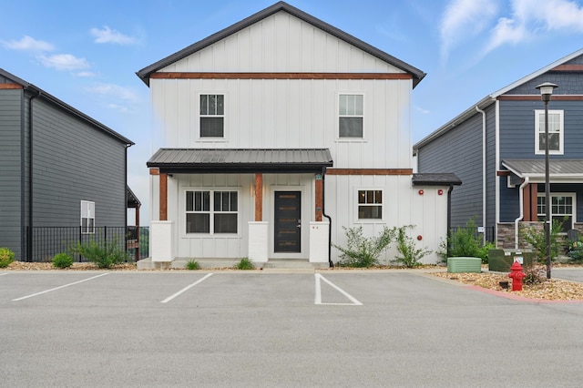 232 Chateau Mountain Hilltop Way, Branson, MO 65616 - view of front facade with board and batten siding, uncovered parking, and metal roof