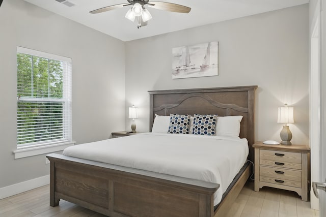 232 Chateau Mountain Hilltop Way, Branson, MO 65616 - bedroom with light wood finished floors, baseboards, and a ceiling fan