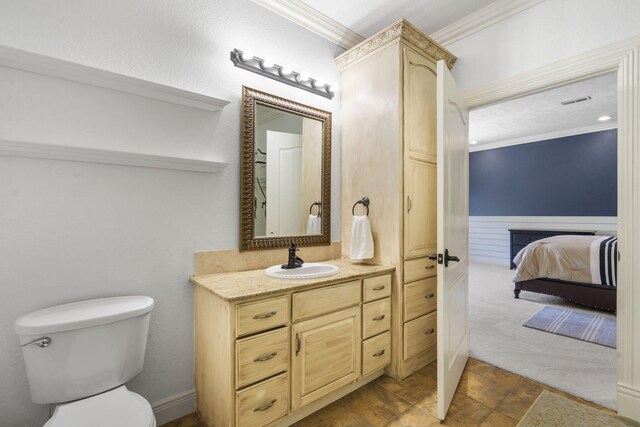 200 Barnes Ln, Branson, MO 65616 - bathroom with ornamental molding, vanity, toilet, and ensuite bath