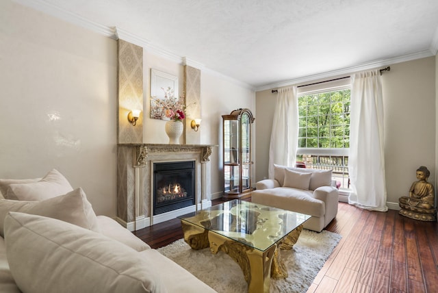 200 Barnes Ln, Branson, MO 65616 - living room featuring hardwood / wood-style floors, baseboards, ornamental molding, and a glass covered fireplace