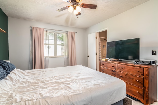 211 Spring Meadows Pkwy, Branson, MO 65616 - bedroom with a textured ceiling and a ceiling fan