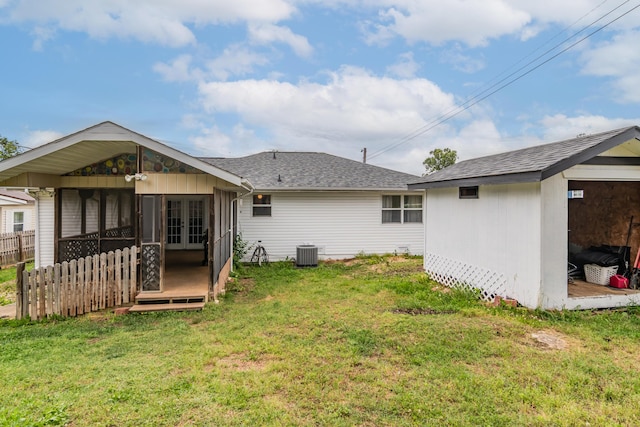 211 Spring Meadows Pkwy, Branson, MO 65616 - back of property featuring french doors, cooling unit, roof with shingles, an outdoor structure, and a wooden deck