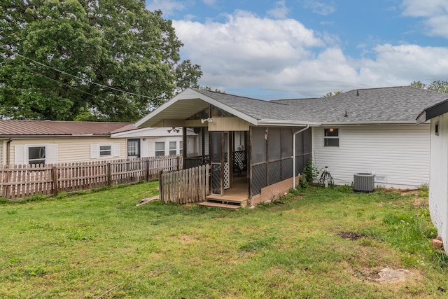 211 Spring Meadows Pkwy, Branson, MO 65616 - back of house featuring a sunroom, roof with shingles, and cooling unit