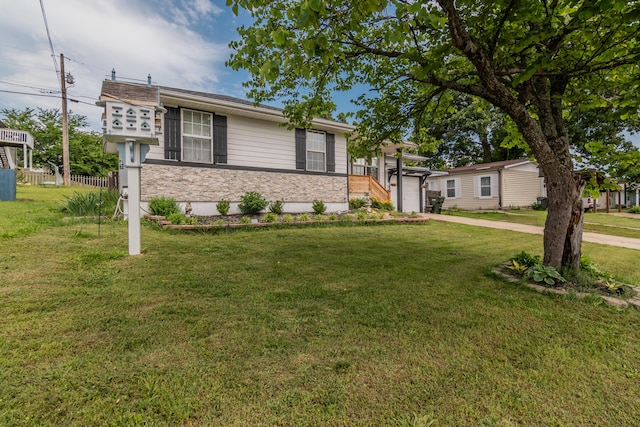 211 Spring Meadows Pkwy, Branson, MO 65616 - ranch-style house featuring a front lawn, stone siding, and driveway