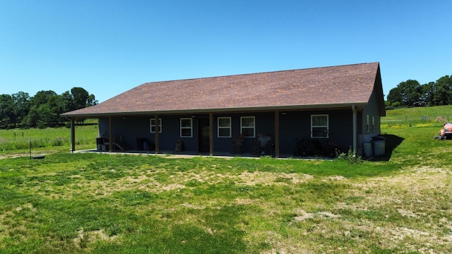 8689 County Road 7110, West Plains, MO 65775 - rear view of property with a lawn and a patio area