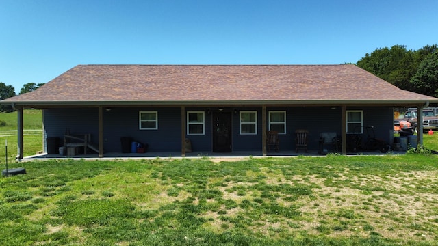 8689 County Road 7110, West Plains, MO 65775 - back of house with a patio area and a lawn