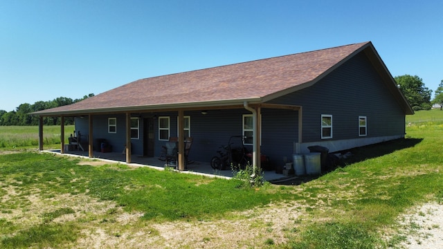 8689 County Road 7110, West Plains, MO 65775 - rear view of house with a yard and a patio