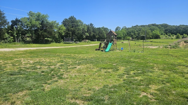 8689 County Road 7110, West Plains, MO 65775 - view of jungle gym featuring a yard