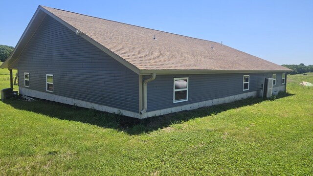 8689 County Road 7110, West Plains, MO 65775 - view of home's exterior with a lawn and a shingled roof