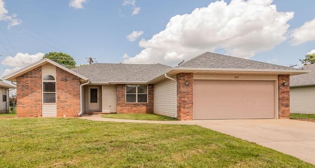 917 Wesley Ave, Nixa, MO 65714 - ranch-style house with brick siding, a garage, concrete driveway, and a front lawn