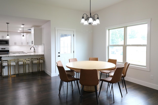 3419 S Suburban Ave, Springfield, MO 65807 - dining space with dark wood-style flooring, baseboards, and a chandelier