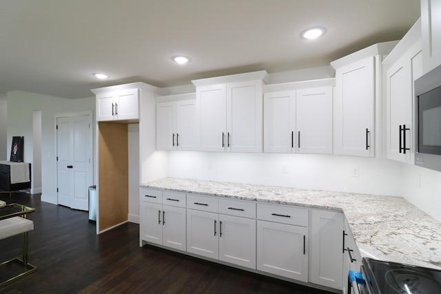 3419 S Suburban Ave, Springfield, MO 65807 - kitchen featuring white cabinets, light stone countertops, electric range oven, dark wood finished floors, and recessed lighting