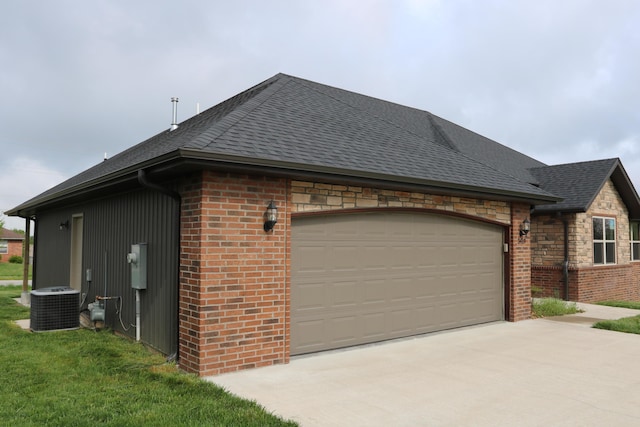 3419 S Suburban Ave, Springfield, MO 65807 - view of property exterior featuring central AC, driveway, an attached garage, and a shingled roof