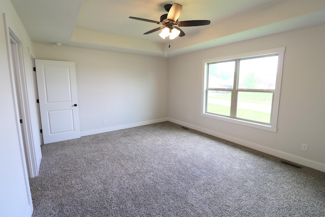 3419 S Suburban Ave, Springfield, MO 65807 - empty room with a raised ceiling, carpet flooring, a ceiling fan, and baseboards