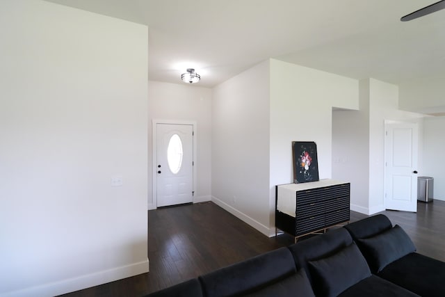 3419 S Suburban Ave, Springfield, MO 65807 - foyer featuring baseboards, dark wood-type flooring, and a ceiling fan