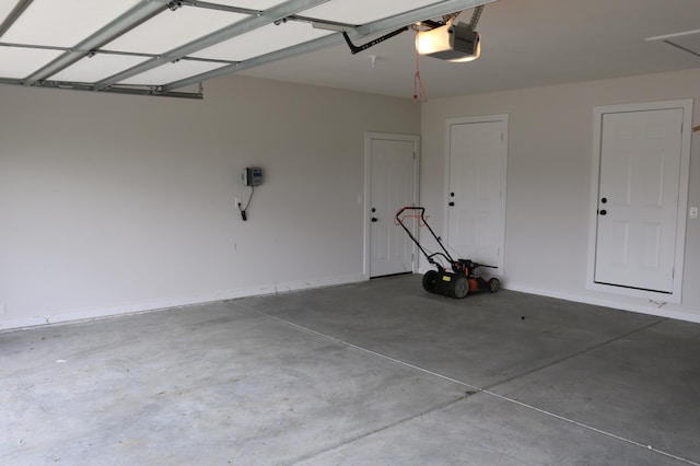 3419 S Suburban Ave, Springfield, MO 65807 - garage with a garage door opener and baseboards