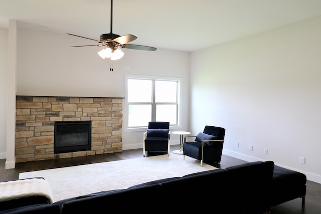 3419 S Suburban Ave, Springfield, MO 65807 - living room with a stone fireplace, wood finished floors, baseboards, and ceiling fan