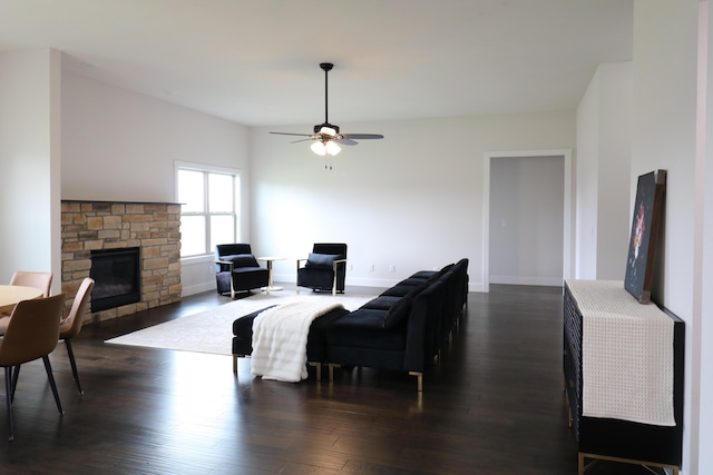3419 S Suburban Ave, Springfield, MO 65807 - living area with a stone fireplace, a ceiling fan, dark wood finished floors, and baseboards