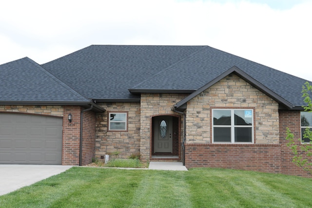 3419 S Suburban Ave, Springfield, MO 65807 - french provincial home with stone siding, a garage, a front lawn, concrete driveway, and a shingled roof