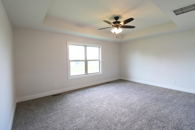 3419 S Suburban Ave, Springfield, MO 65807 - carpeted spare room with a tray ceiling, baseboards, and ceiling fan