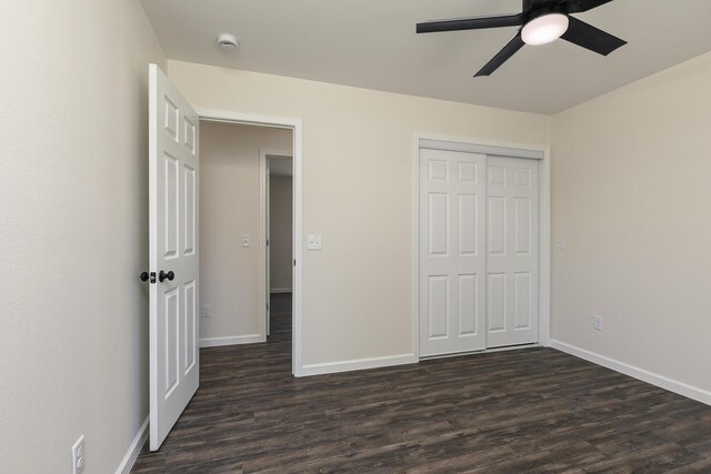 281 N 2nd St, Verona, MO 65769 - unfurnished bedroom featuring dark wood finished floors, baseboards, a closet, and ceiling fan