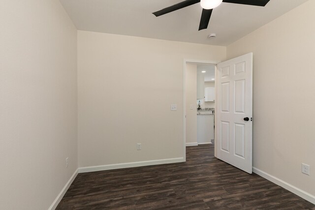 281 N 2nd St, Verona, MO 65769 - empty room featuring a ceiling fan, dark wood finished floors, baseboards, and a smoke detector