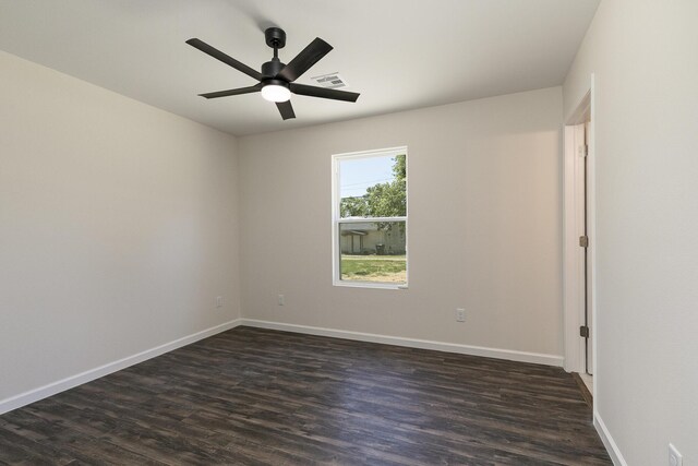 281 N 2nd St, Verona, MO 65769 - spare room featuring dark wood finished floors, ceiling fan, and baseboards