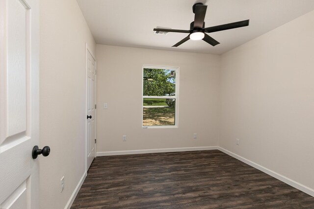 281 N 2nd St, Verona, MO 65769 - spare room with ceiling fan, dark wood-style floors, and baseboards