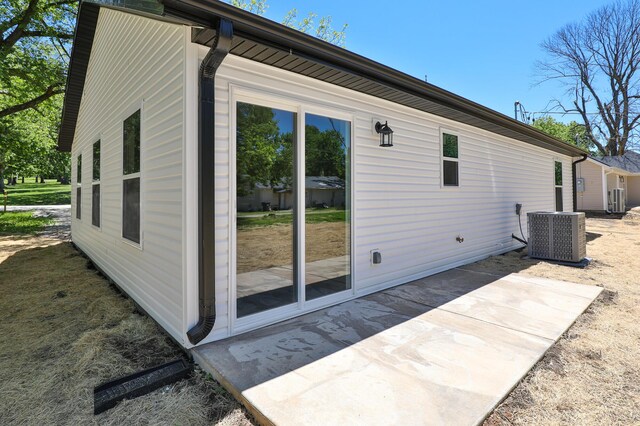 281 N 2nd St, Verona, MO 65769 - view of side of property featuring central air condition unit and a patio