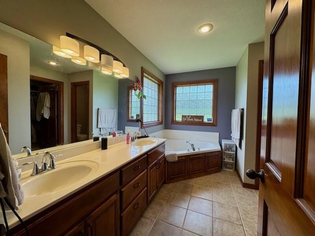 1054 W Itaska Rd, Nixa, MO 65714 - full bath featuring double vanity, a garden tub, tile patterned flooring, and toilet