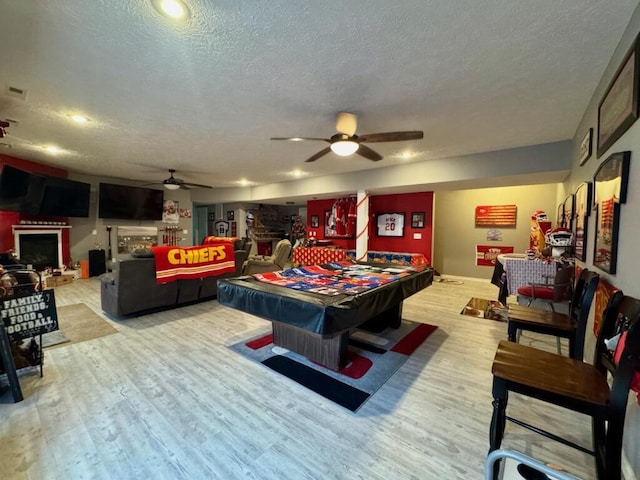 1054 W Itaska Rd, Nixa, MO 65714 - game room with ceiling fan, billiards table, wood finished floors, and a textured ceiling