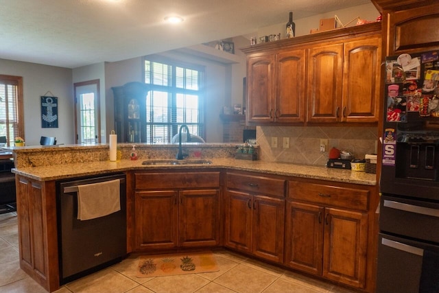 1054 W Itaska Rd, Nixa, MO 65714 - kitchen with a sink, dishwashing machine, light stone counters, fridge with ice dispenser, and a peninsula