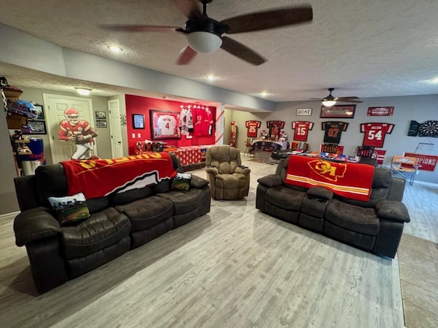 1054 W Itaska Rd, Nixa, MO 65714 - living area featuring a ceiling fan, a textured ceiling, wood finished floors, and recessed lighting