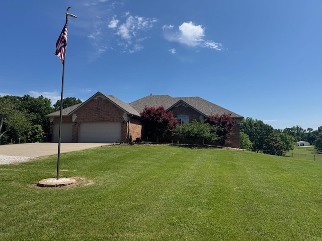 1054 W Itaska Rd, Nixa, MO 65714 - single story home featuring a front lawn, an attached garage, brick siding, and concrete driveway