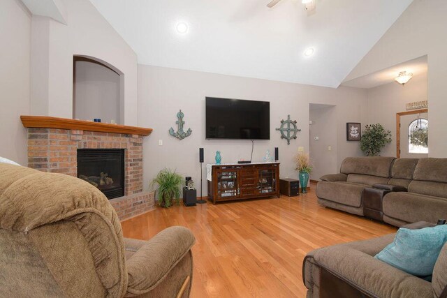 1054 W Itaska Rd, Nixa, MO 65714 - living area featuring wood finished floors, ceiling fan, a fireplace, high vaulted ceiling, and recessed lighting