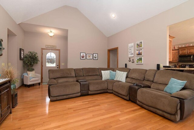 1054 W Itaska Rd, Nixa, MO 65714 - living area featuring light wood-style floors and high vaulted ceiling