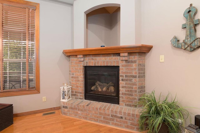 1054 W Itaska Rd, Nixa, MO 65714 - detailed view of wood finished floors and a fireplace