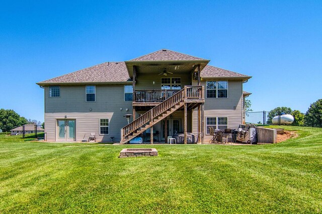 1054 W Itaska Rd, Nixa, MO 65714 - rear view of house with a ceiling fan, stairway, french doors, a wooden deck, and an outdoor fire pit