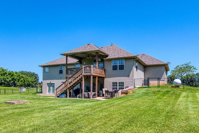 1054 W Itaska Rd, Nixa, MO 65714 - back of house featuring stairway, a wooden deck, a ceiling fan, a fenced backyard, and a patio area