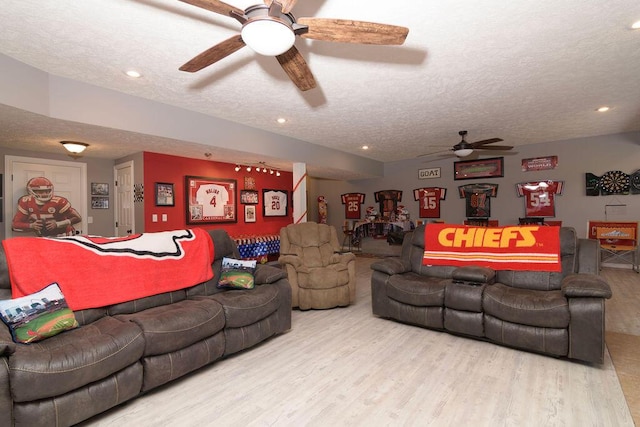 1054 W Itaska Rd, Nixa, MO 65714 - living room with ceiling fan, wood finished floors, a textured ceiling, and recessed lighting
